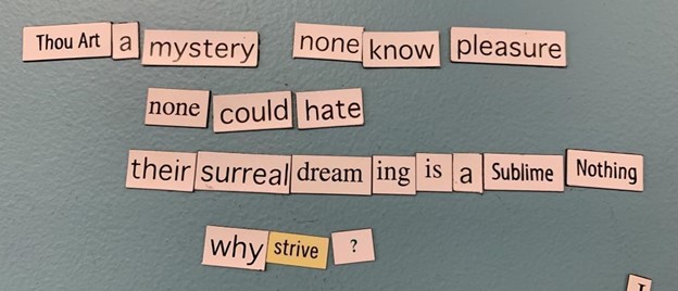 Magnetic poetry on a blue background that says, “Thou art a mystery none know pleasure / none could hate / their surreal dreaming is a sublime nothing / why strive?”